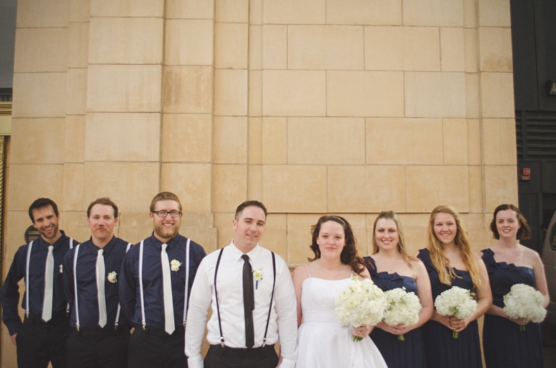 Wedding Bridal Party posing for Photograph in front of the D and F Clock Tower in Denver, Colorado