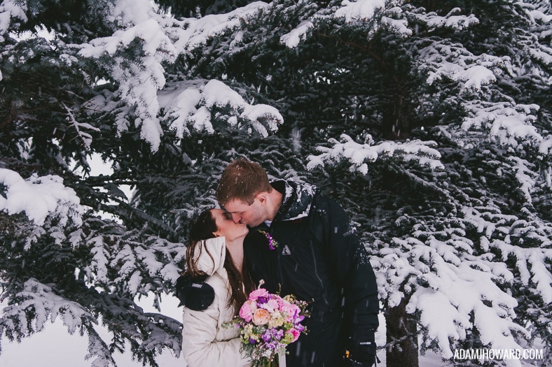 Photograph of Bride and Groom Kissing in a Jackson Hole Winter Wedding