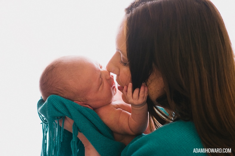 Mother Kissing Baby Newborn Photograph