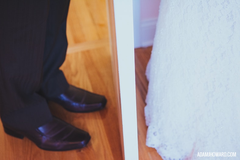 couple does a first look on their wedding day, shot of their shoes
